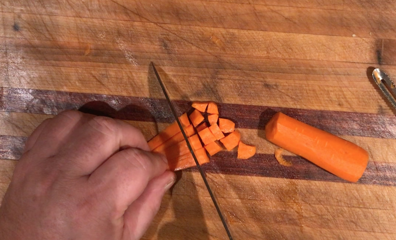 Group the sticks together and chop cross-wise to create cubes