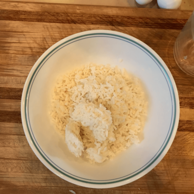 Put the cold rice in a bowl, add a little cornstarch and salt, and mix with your hands to break up clumps