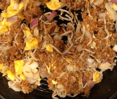 Add the egg yolk and the vegetables to the rice