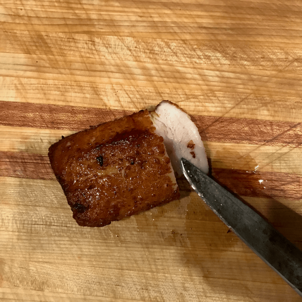 A finished piece of Kou Rou, tender and juicy inside