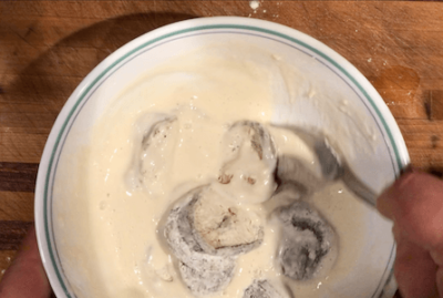 Add the mushrooms to the batter and stir to coat