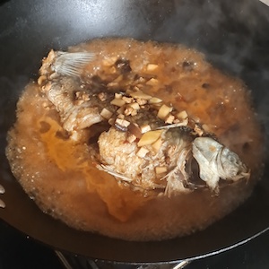 add water and simmer the fish