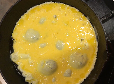Add eggs to hot pan and let it get firm