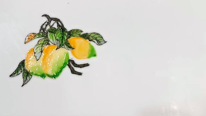 Closeup of a mango, painted with jam