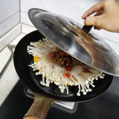 Place the dish on a steamer plate, and cover in wok containing boiling water