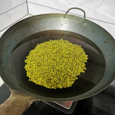 add the mung beans and water to a wok