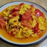 Tomatoes and scrambled eggs