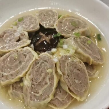 Pork Egg Rolls in sauce