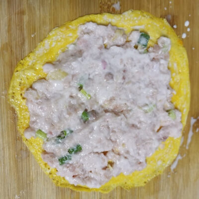 add half the pork mix to each egg patty