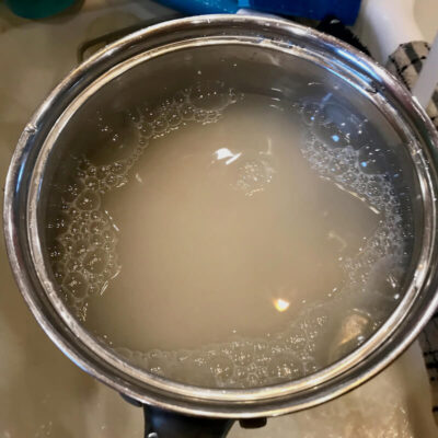 Rinse the rice with cold water