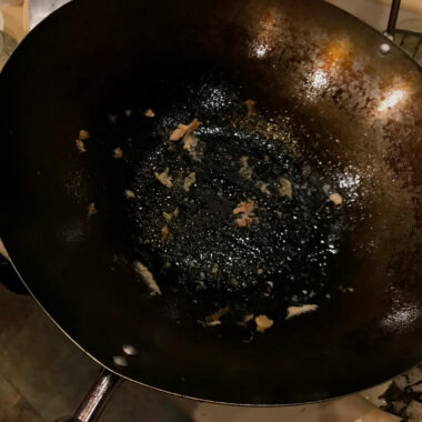 Learning from Mistakes: Seasoning a wok