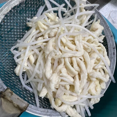 Use a large skimmer to remove the ingredients from the oil