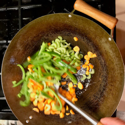 Add the shrimp to the vegetables and sauce, toss to combine.