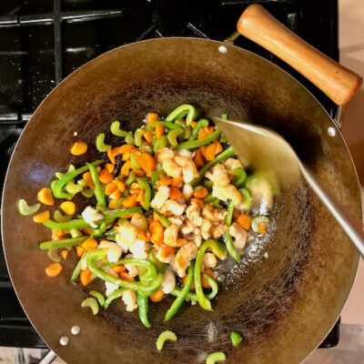 Add the shrimp to the vegetables and sauce, toss to combine.