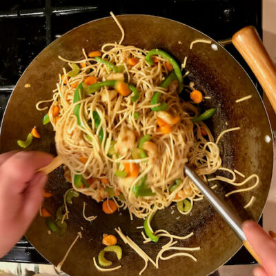 Toss the noodles with the other ingredients using a pair of chopsticks.