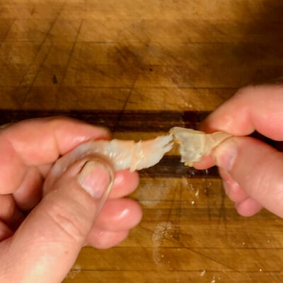 Pull the tail away from the shrimp