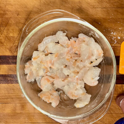 toss the shrimp with Shaoxing wine and salt, then lightly coat with cornstarch