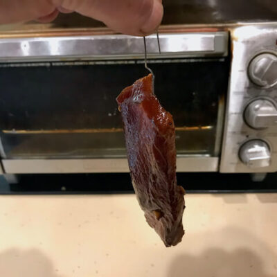 Hang the slabs of pork by one end.