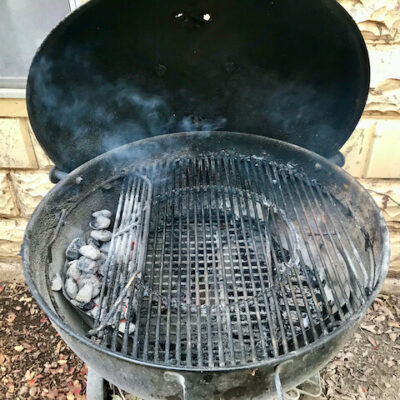 Bank the coals to one side. This is not grilling, it's barbecue, using low, indirect heat.