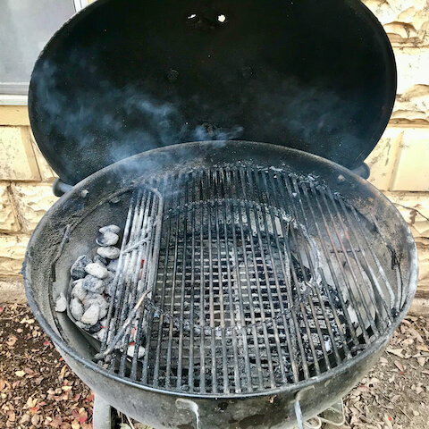 Bank the coals to one side. This is not grilling, it's barbecue, using low, indirect heat.