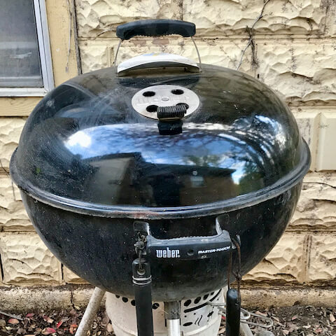 The dome shaped lid of the kettle grill serves as a convection oven.