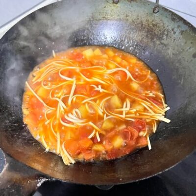 Add the noodles to the broth.