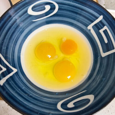 Crack three eggs into the bowl
