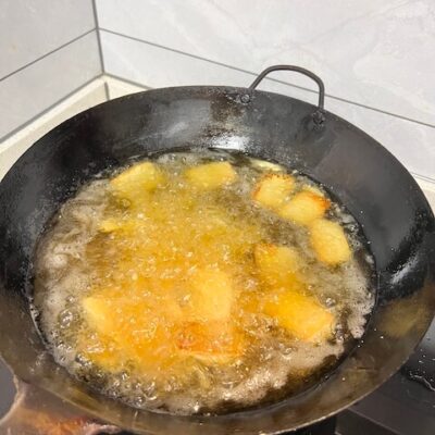 Deep fry the sliced tofu to a golden brown