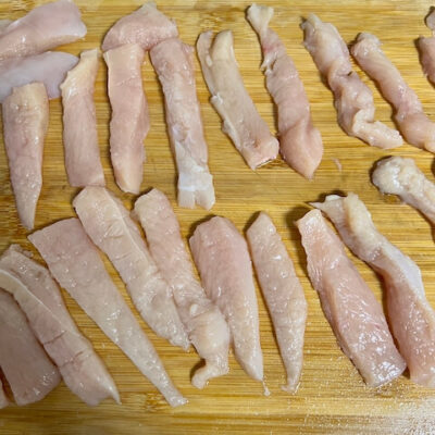 Cut the chicken fillets into strips