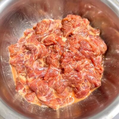 Marinate and velvet-coat the beef.