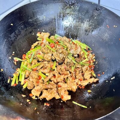 Stir-fry the beef with other ingredients to finish.