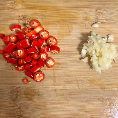Chop the chili peppers, mince the garlic cloves