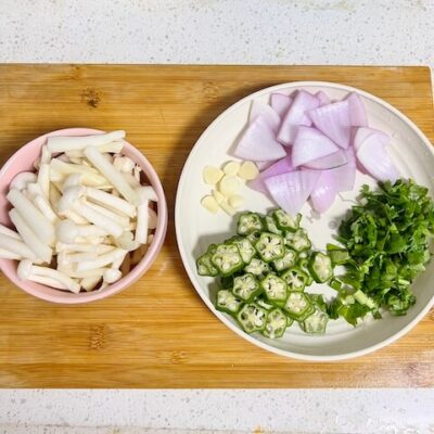 chop the ingredients for Chinese mushroom noodle soup